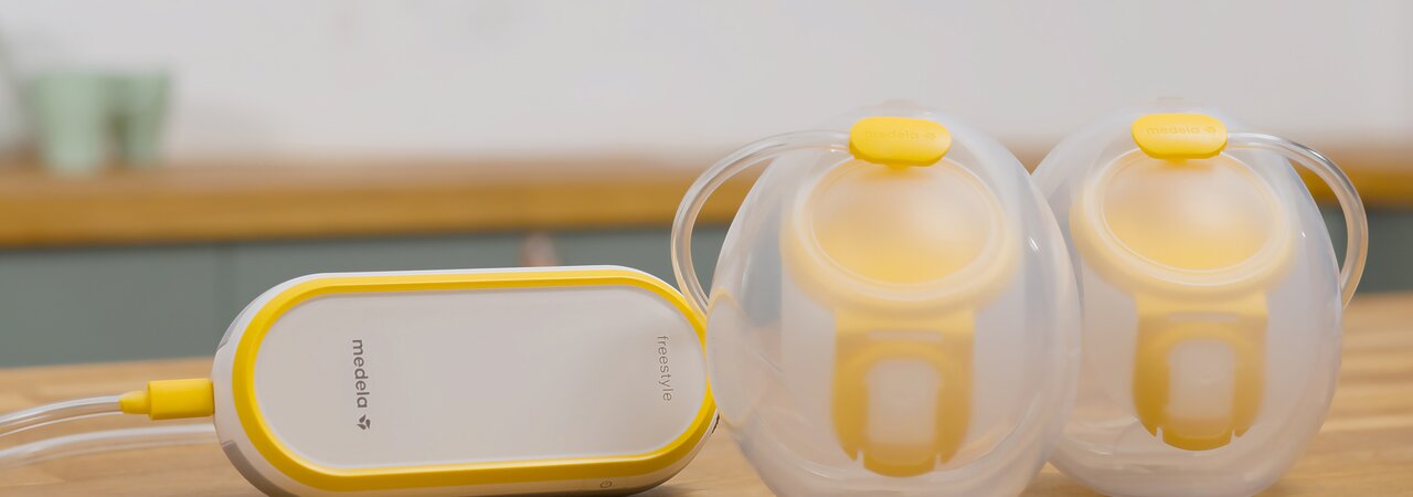 Freestyle™ Hands-free double electric wearable breast pump Medela Freestyle™ Hands-free double electric wearable breast pump sitting on counter