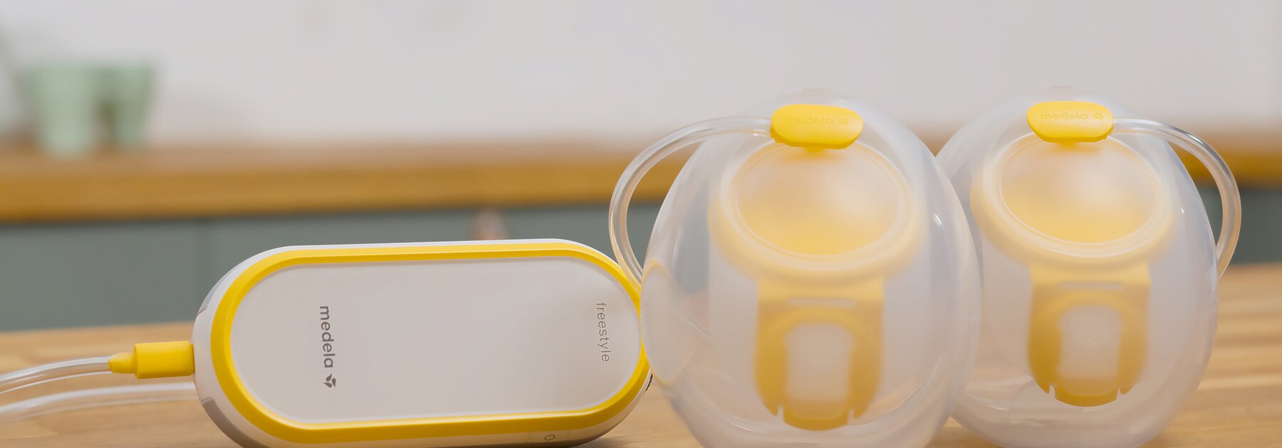 Medela Freestyle™ Hands-free double electric wearable breast pump sitting on counter
