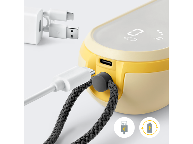 Close-up of Medela Freestyle™ Hands-free double electric wearable breast pump with the charger cord being inserted into the pump