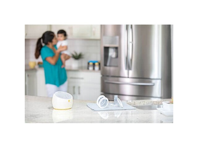 Medela Sonata® Smart double electric breast pump and parts sitting on countertop after cleaning