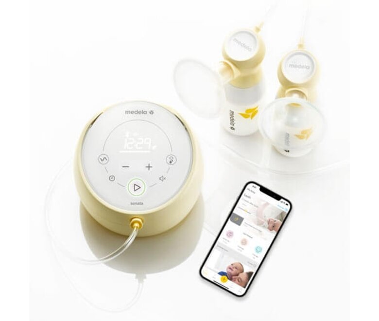 Medela Sonata® Smart double electric breast pump shown with breast shields, storage containers, tubing and a cell phone open to the Medela App