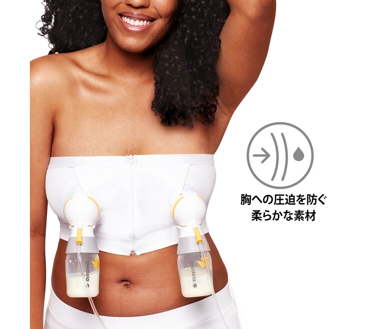 A woman wears a HANDS-FREE™ ハンズフリーさく乳ブラ in Chai. Image text “No breast compression”.