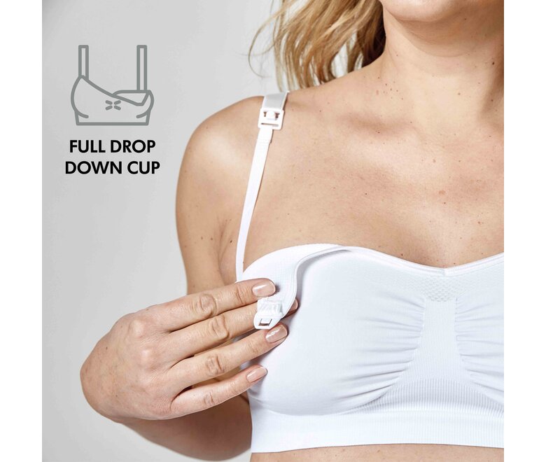 Mãe a usar um soutien Medela Keep Cool™ branco com o texto “Copo cheio de gotas”