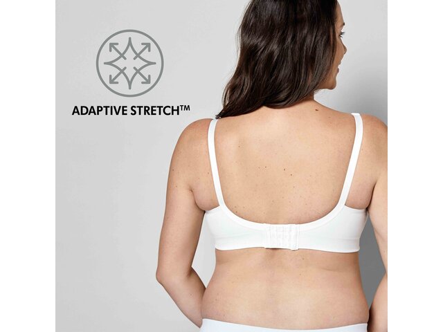 Woman wearing a white Medela Keep Cool™ Ultra Bra back view with text, "Adaptive Stretch"