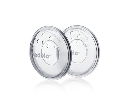 Angled view of a pair of Medela SoftShells™ breast shells.