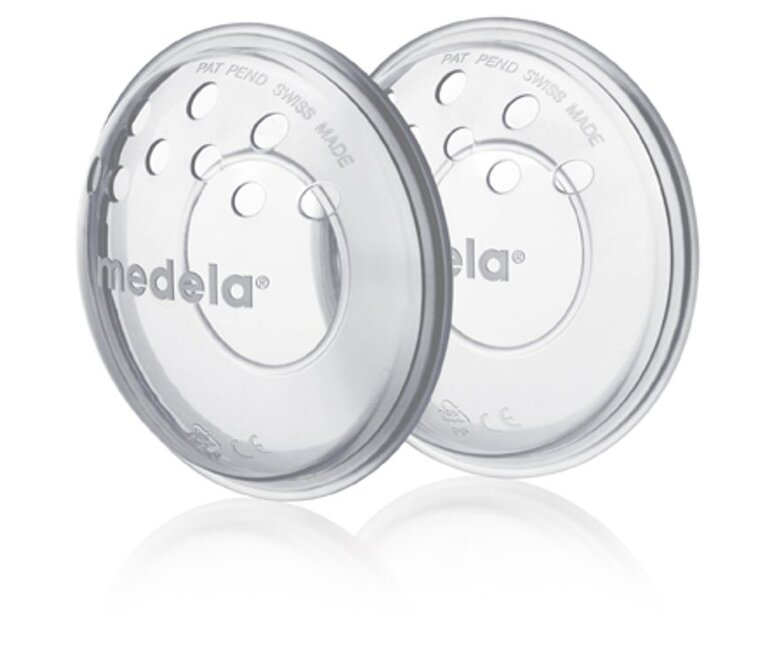 Angled view of a pair of Medela SoftShells™ breast shells.