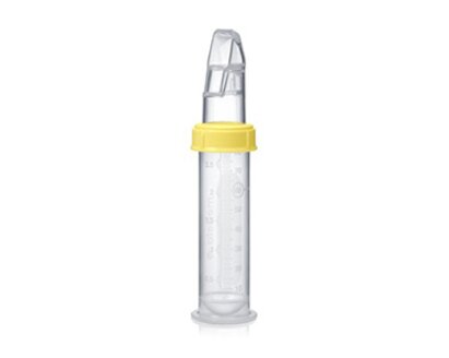 An advanced cup feeder, the Medela SoftCup™. It is connected to a reusable Medela breast milk storage bottle.