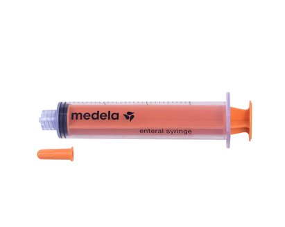 TwistLok Enteral Syringe group. Various sizes of TwistLok syringes with plungers pushed down.