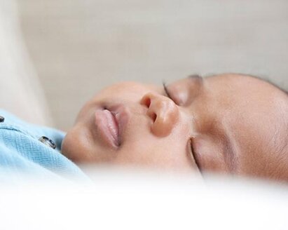 Close-up of a sleeping baby boy.