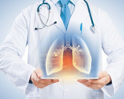 Doctor holding holograph of human lungs