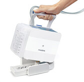 A Medela Thopaz Plus being placed into its docking station.