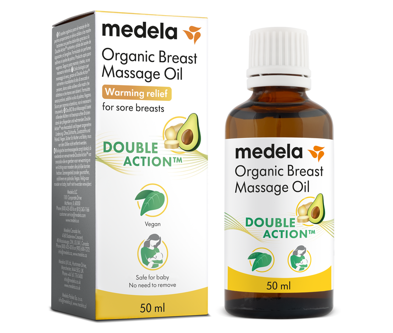 Un flacone da 50 ml di olio per il massaggio del seno di Medela accanto alla confezione di vendita.