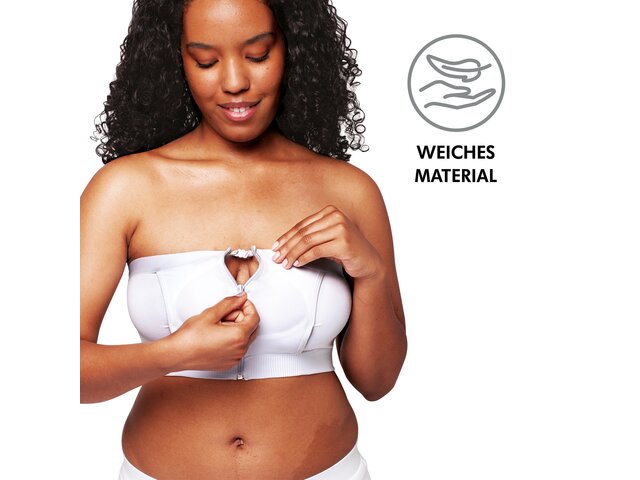 Frau trägt ein Hands-free™ Pumping Bustier Weiß mit dem Text „ Weiches Material“.