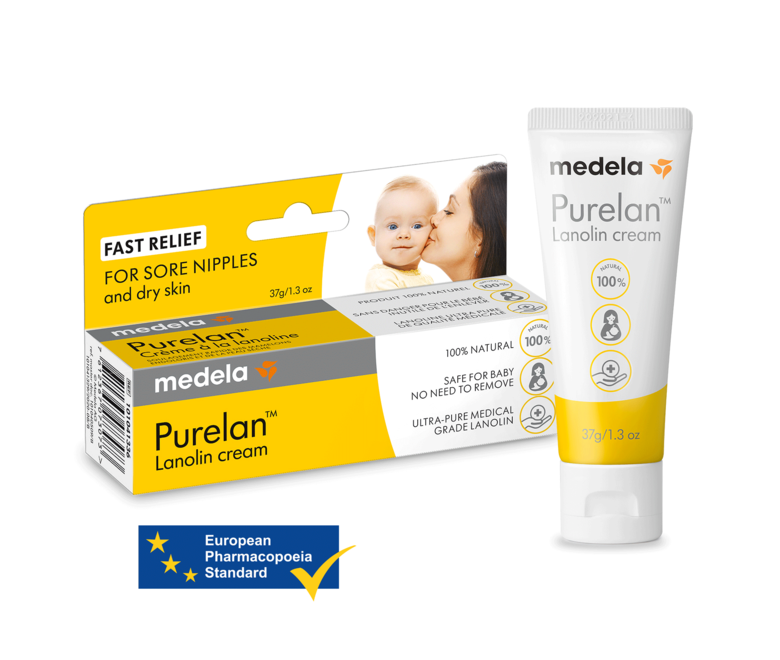 Een tube Purelan™ lanolinecrème van 37 gram van Medela naast de winkelverpakking. Bevat ook de tekst “European Pharmacopoeia Standard”.