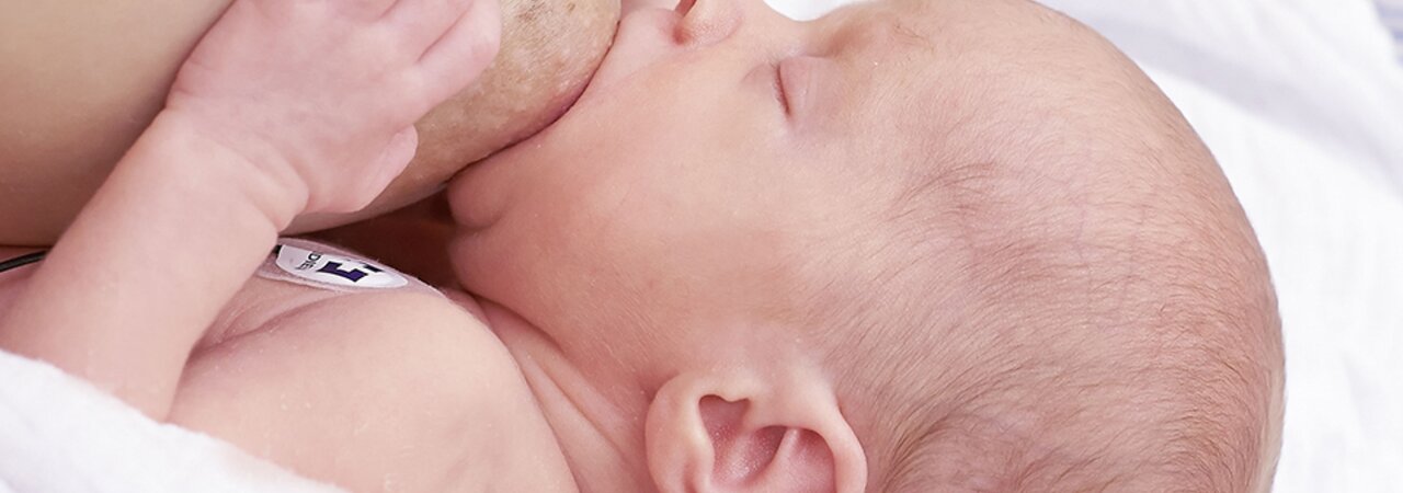 Close-up of a nursing baby.