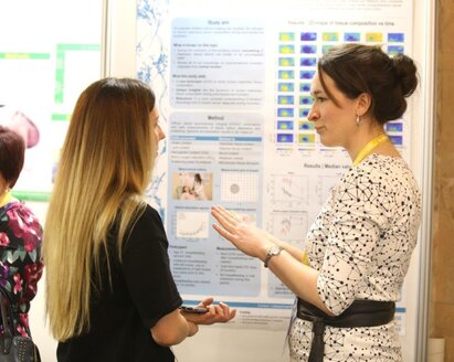 Guests in conversation during a Medela symposium.